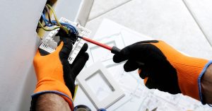 Licensed electricians troubleshooting electric problems in a South Jersey home