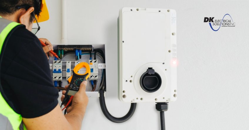 Electrician installing EV charger at home